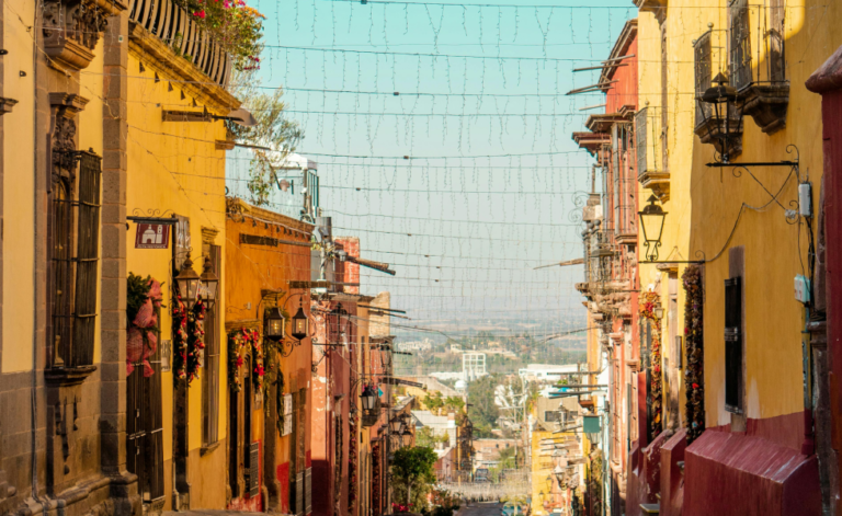 a mexican street with christmas lights